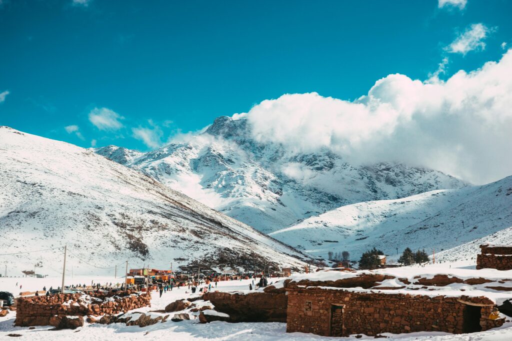 Snow-covered landscape in Oukaimeden, Morocco with scenic mountain views.